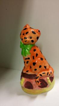 Leopard with bow tie sitting on a pillow by LouiseTSL