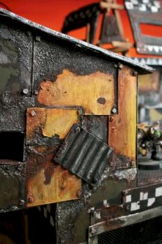 Close up of scrap metal plating by Terraformer