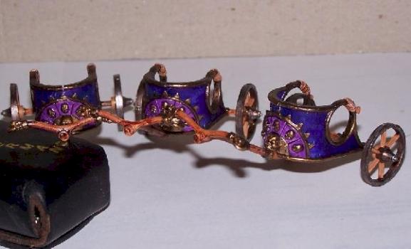 Three unfinished chariots by Sippe