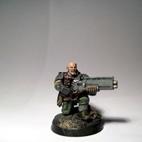 Veteran Sergeant with shotgun by new