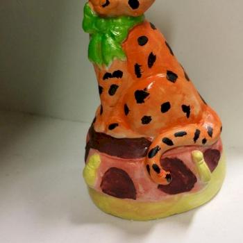 Leopard with bow tie sitting on a pillow by LouiseTSL